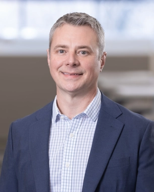 smiling person in professional attire